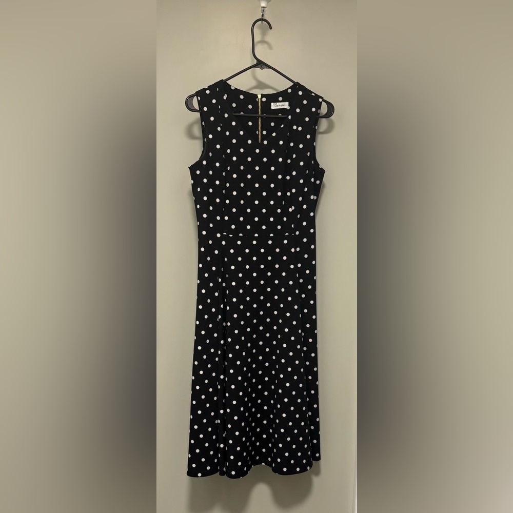 Calvin Klein fit and flare type dress with pockets. See measurements